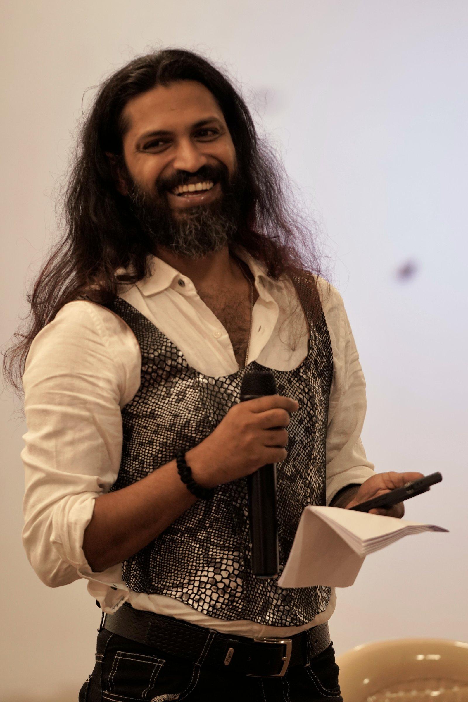 Shyam wearing the first Kavach, a snakeskin-foil leather corset over a white shirt